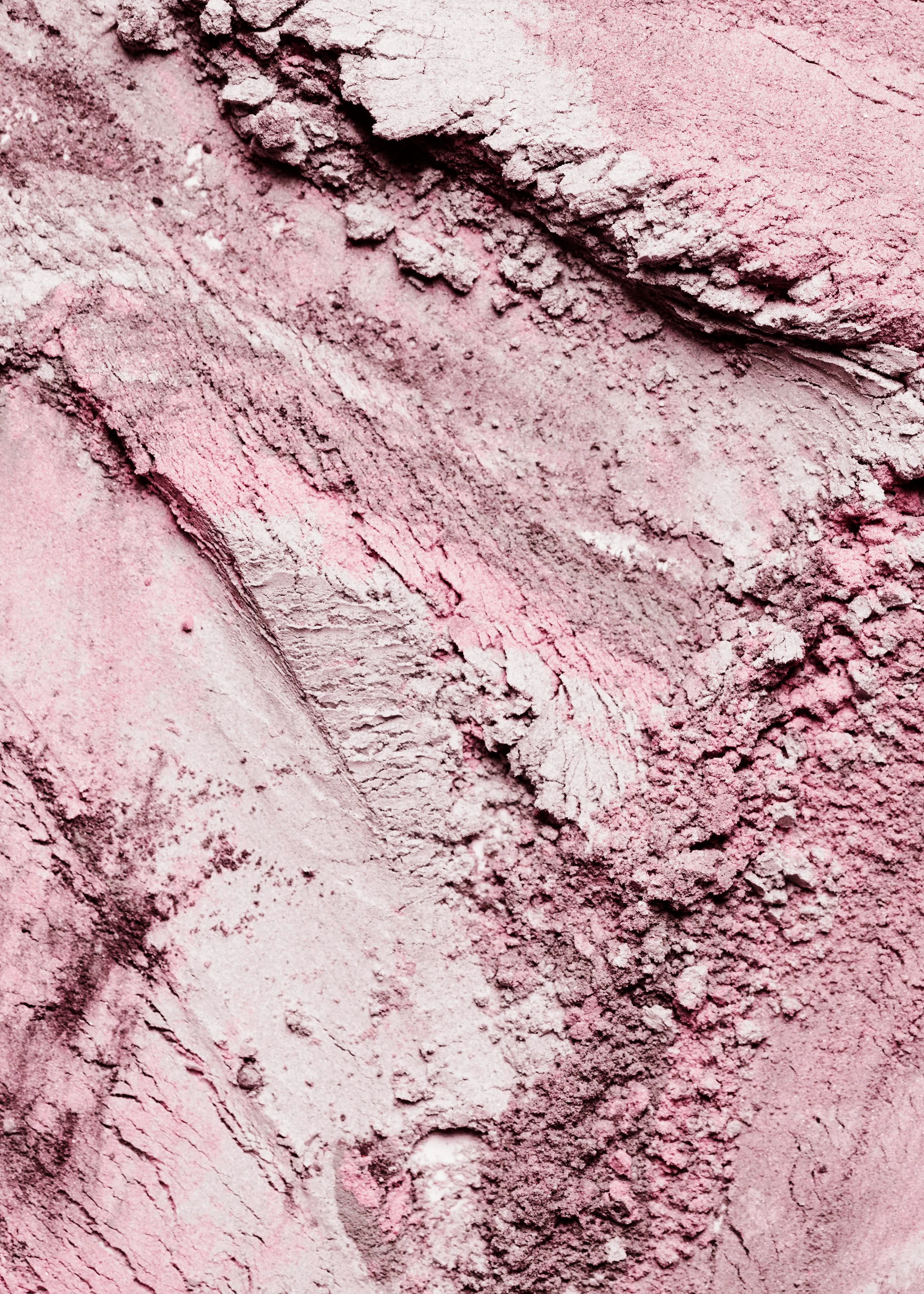 Crushed cosmetic pigment texture in mauve tones
